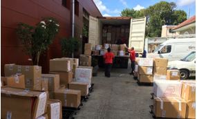 AGS loading boxes in truck for transport in Martinique.