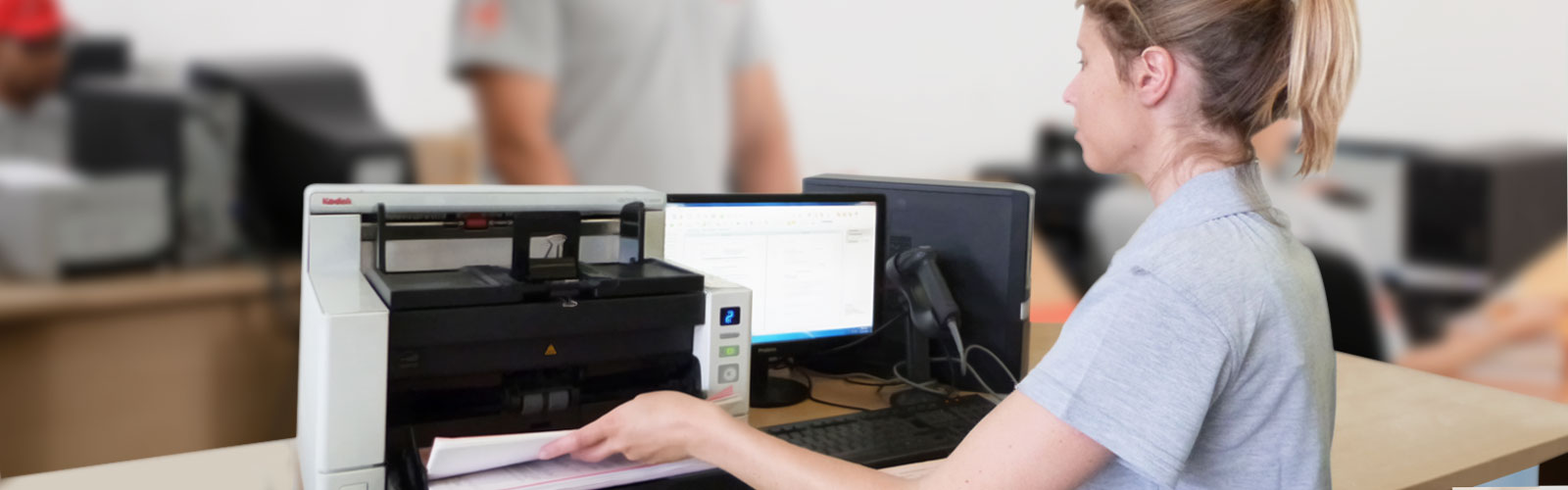 Records management staff scanning documents