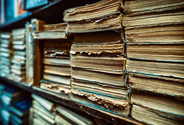 Old books being stored in a library as archives